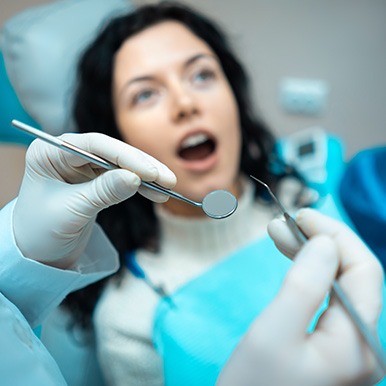 A dentist about to treat a patient’s teeth