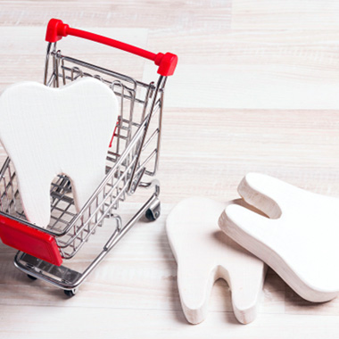 Toy teeth in small shopping cart